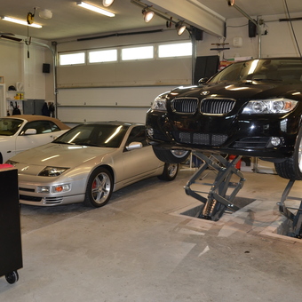 Home garage with car lift, tool chest, and sports cars - Gordon Richards from Holly Hill, FLORIDA