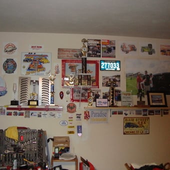 Garage Wall with Trophies, Signs, Tools, and License Plates - jacks trophy wall