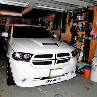 Organized Garage with White Dodge SUV and Wall Shelving - FSTDANGO3 from BLOOMIMGDALE, NEW JERSEY