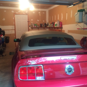 Organized garage with red Mustang GT and motorcycle - John D. from Honey Brook, Pa