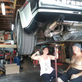 DeLorean on Lift in Busy Garage Workshop - Robert from Oviedo, Fl