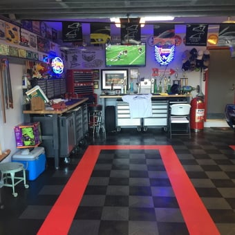 Organized garage with tool cabinets and wall decor - Wally from Coral Springs, Florida