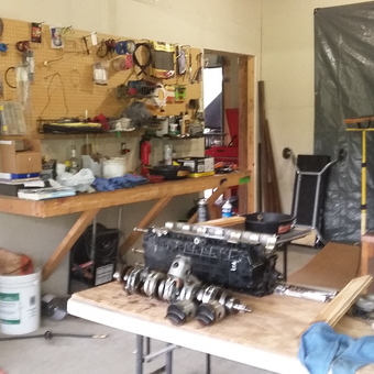 Organized Garage Workbench with Tools and Engine Parts - Nikki from Clanton, AL