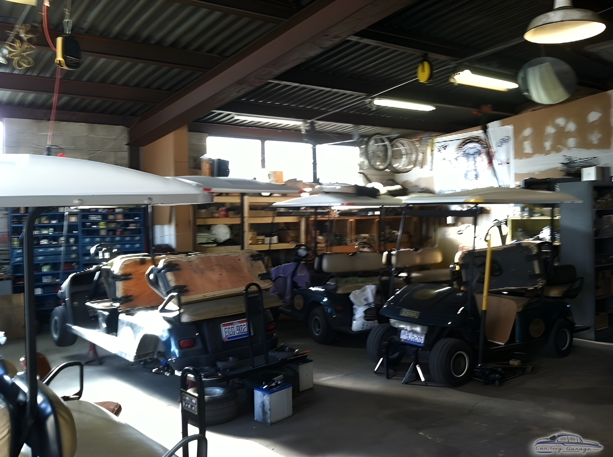 Golf cart repair garage with storage shelves and tools - Golf cart guy