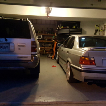 Organized garage with two cars and tool storage - David from Kansas City, MO