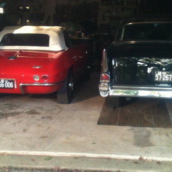 Classic Red Convertible and Black Sedan in Organized Garage - High Gear from Wilmington, de