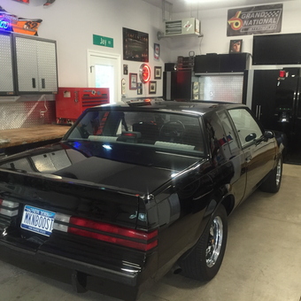 Organized garage with classic car, cabinets, and neon signs - MKNBOOST from Lewiston, New York