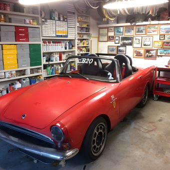 Organized garage with classic red convertible and storage - David from Nashville, TN