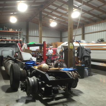 Spacious garage with vehicle frame, tools, and boat - Sprink from Beaumont, Tx