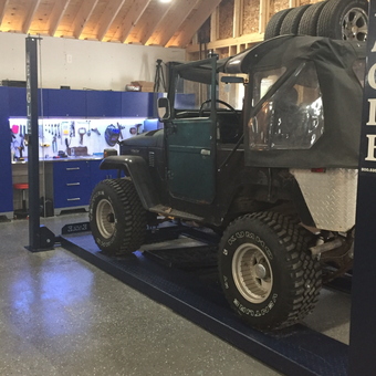 Jeep on Car Lift with Blue Cabinets - Rocky71 from Dolgeville, New York