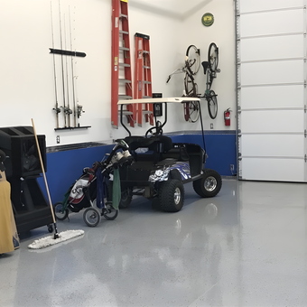Organized garage with wall racks, ladders, and golf cart - James from Pahrump, Nevada