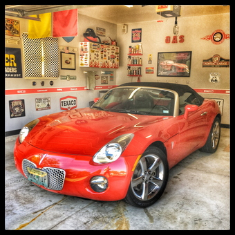 Pontiac Garage with Classic Signs and Red Convertible - JCS from St Charles, MO