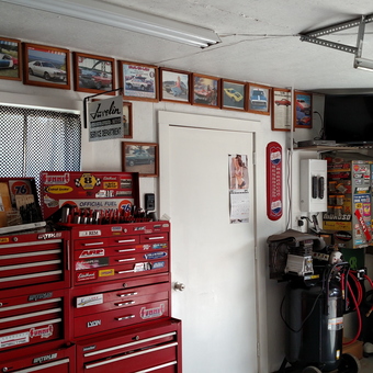 Organized garage with red tool chests and wall art - AMXAL from SANDWICH, IL