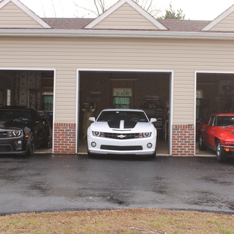 Three Chevrolet Cars Parked in Spacious Garage - Obie from Abington, Pennsylvania
