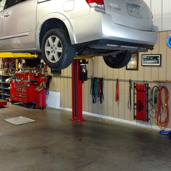 Organized garage with car lift, tool chests, and wall storage - Jay from Pembroke, Massachusetts