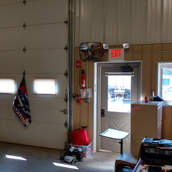 Organized garage with flags, cabinets, and office desk - Jay from Pembroke, Massachusetts