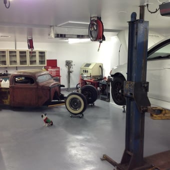 Organized garage with car lift, tool cabinets, and hot rod - i c e b l u e from Peoria, Illinois