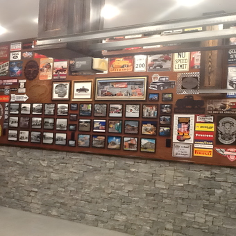 Garage wall with vintage automotive signs and decor - RALPH from DANBURY, CONN