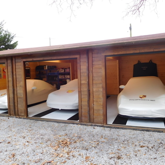 Triple garage with Porsche car covers and wall decor - Sean from Rochester, Kent