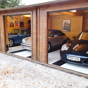 Wooden garage with classic Porsche cars and posters - Sean from Rochester, Kent