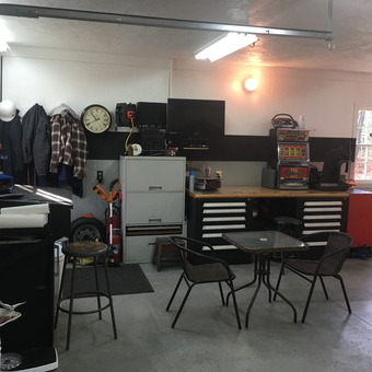Organized garage with workbench, cabinets, and decor - MyThunder from Southington, Ct