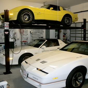 Home garage with car lift, classic cars, and wall tool storage - Michbc3 from Port St. Lucie, Florida