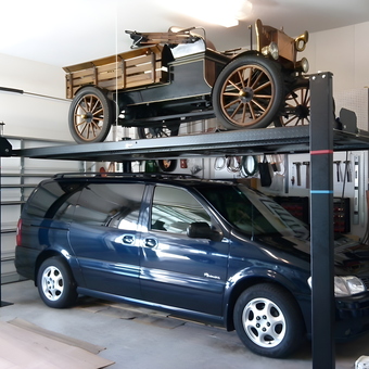 Four post car lift storing classic and minivan - Michbc3 from Port St. Lucie, Florida