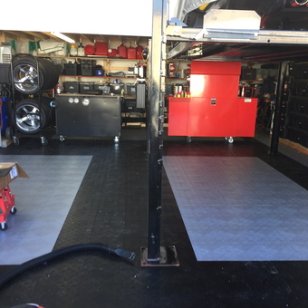 Organized garage with tool cabinets, tire racks, and lift - TimD38 from Hudson, WI