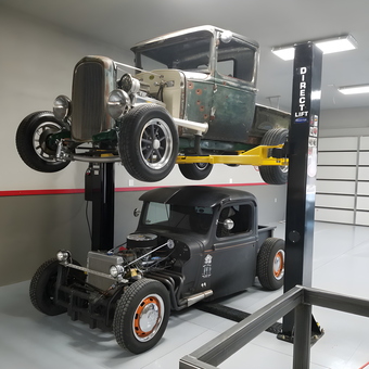 Classic cars on four post lift in organized garage - Will from Redmond, Oregon