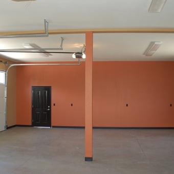 Spacious garage with orange walls and black doors - Bogy409 from Stockton, CA