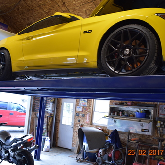 Four post car lift with yellow Mustang and motorcycle - Paul from Augusta, Maine