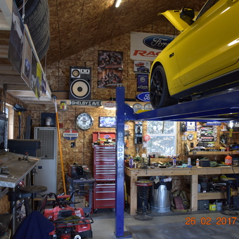 Organized garage with car lift, tool chest, and workbench - Paul from Augusta, Maine