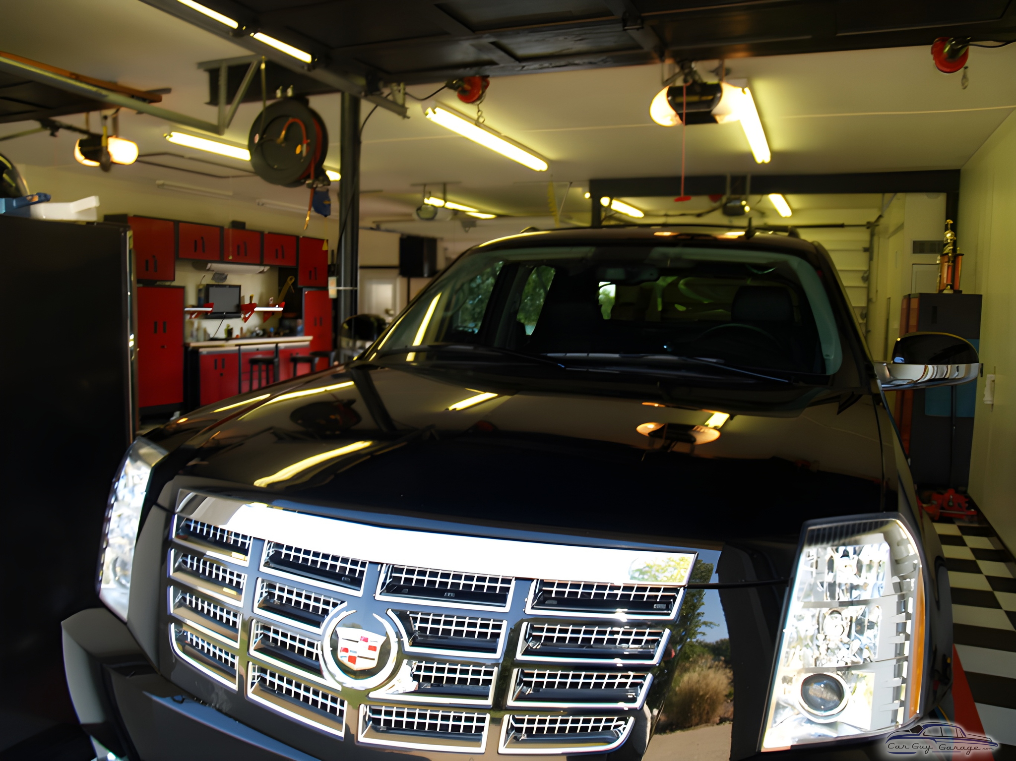 Organized garage with red cabinets and Cadillac - Michael from Newburgh, IN