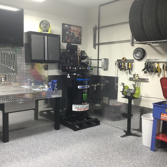 Organized garage with tool cabinets, workbench, and tire rack - DoubleD23 from Omaha, NE