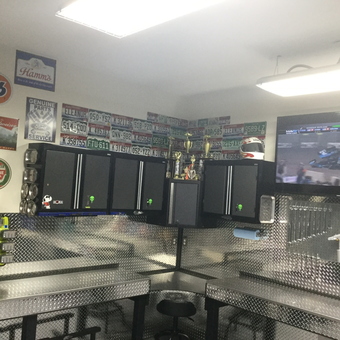 Organized garage with metal cabinets, workbenches, and wall decor - DoubleD23 from Omaha, NE