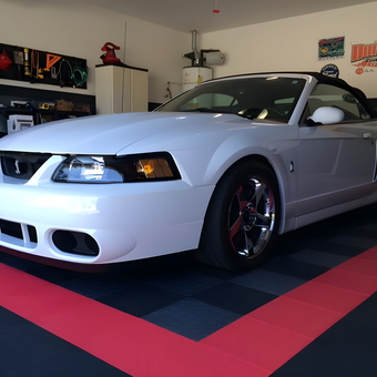 Organized garage with white convertible and floor tiles - Christopher Durbin from Summerville, South Carolina