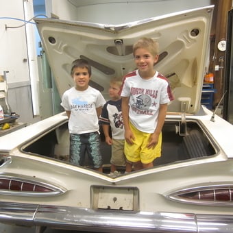 Classic Car Garage with Open Trunk and Kids - Ray May from Rochester, New York