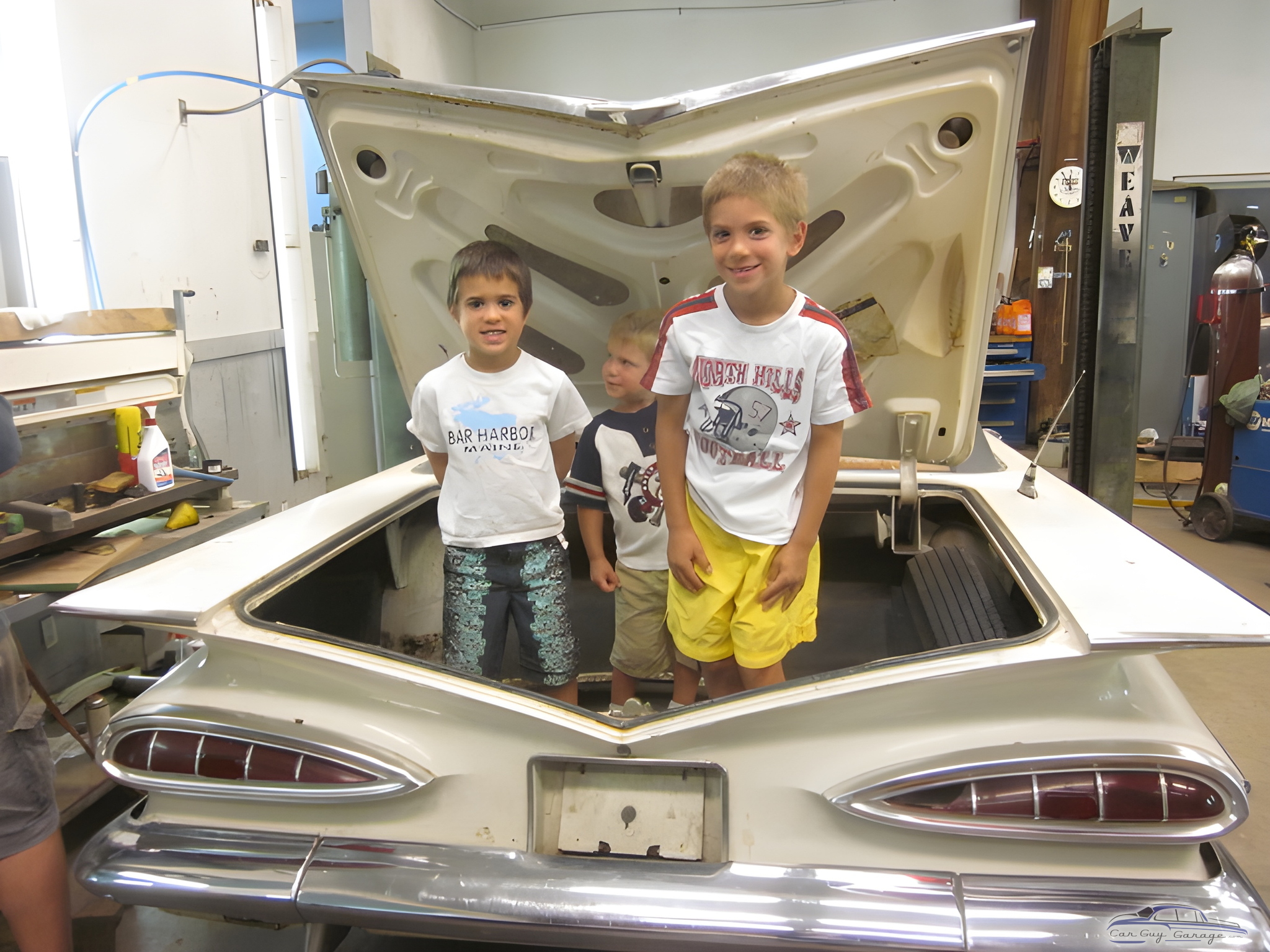 Classic Car Garage with Open Trunk and Kids - Ray May from Rochester, New York