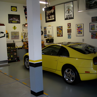 Organized garage with yellow sports car and wall art - Aaron from Farmington, UT