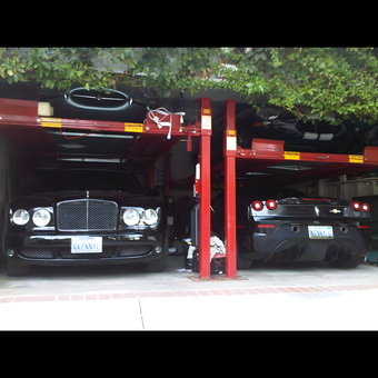 Luxury Cars on Red Car Lifts in Garage - Kenny Lombino from Beverly Hills, Ca