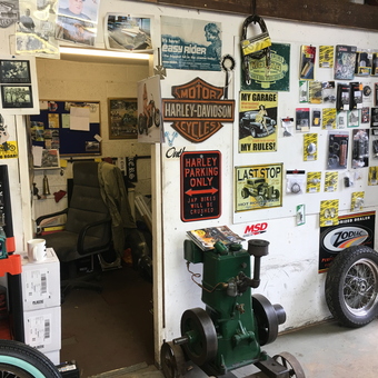 Garage wall with vintage signs, auto parts, and tools - Bruce Renfrew from Leicester, Leicestershire