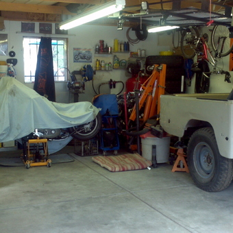Organized garage with covered motorcycle and tools - ingrid gustavson from commerce city, CO