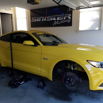 Yellow Mustang on Jack Stands in Organized Garage - Latrry from Gloucester, VA