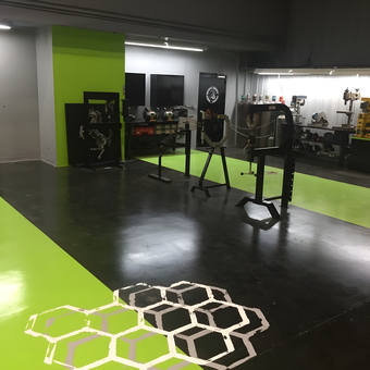 Modern garage with green epoxy floor and workbenches - Shanon Parker from Port Canaveral, Fl