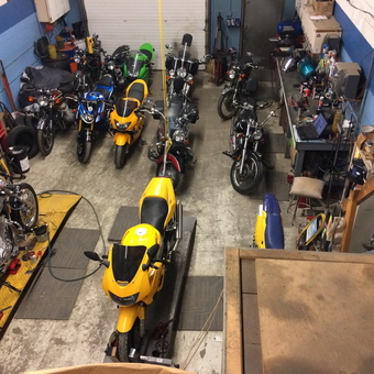 Motorcycle Repair Shop with Tools and Workbenches - Bikes