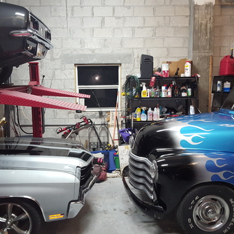 Classic Cars on Lift with Shelving and Fuel Cans - Keypilot from Marathon, fl.