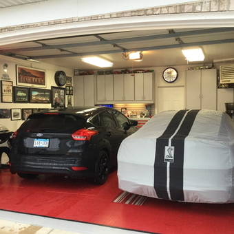 Organized garage with cabinets, car covers, and decor - Bruce from Eden Prairie, MN