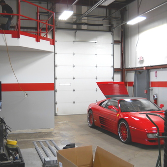 Red Ferrari in Modern Garage with Tools and Loft - Z