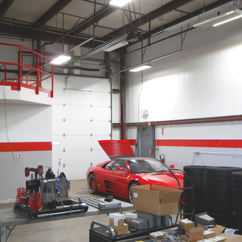 Organized Garage with Red Sports Car and Tools - Z
