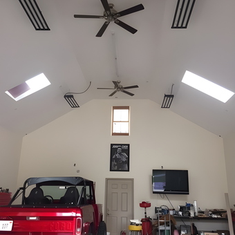 Spacious Garage with Ceiling Fans, Lighting, and Workbenches - Z